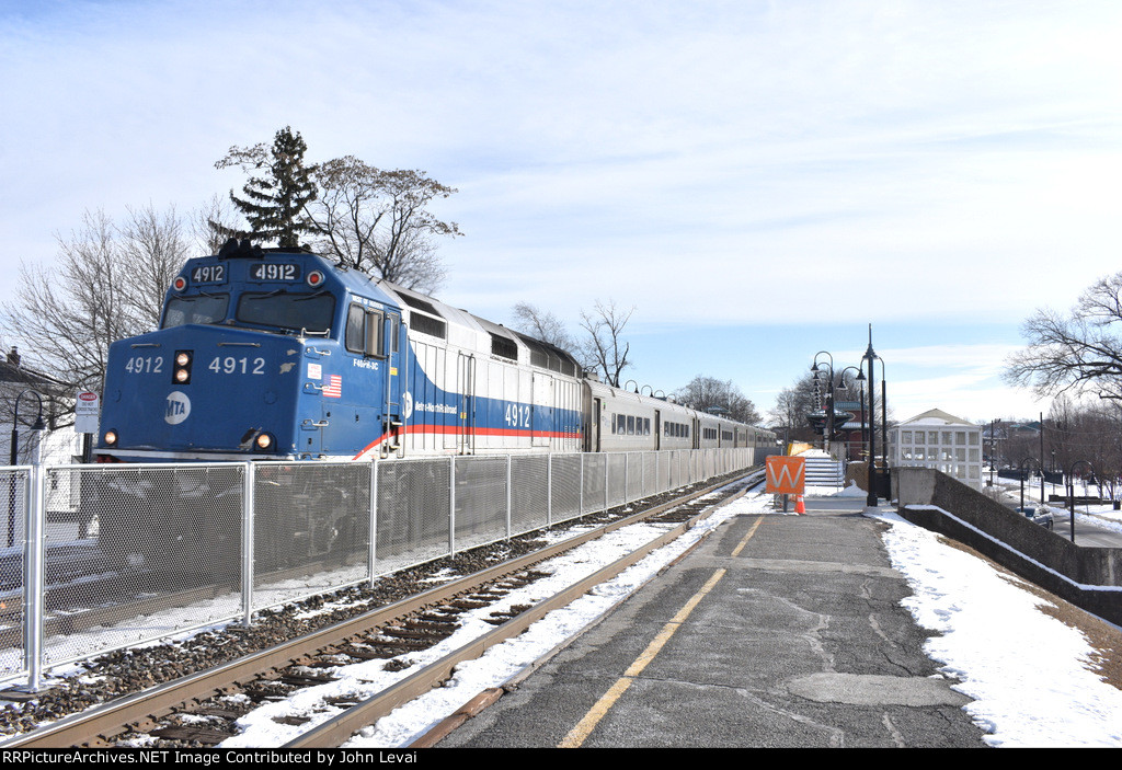 NJT Train # 75, with MNR F40PH-3C # 4912, pulling a Comet V set heading past Lyndhurst Station, enroute from Hoboken Terminal to Port Jervis